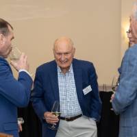 Ron Dalman in conversation with several other guests